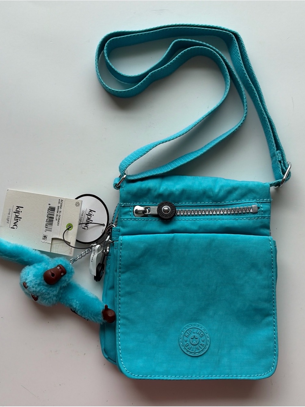 Kipling Turquoise Crossbody Bag with Monkey Charm